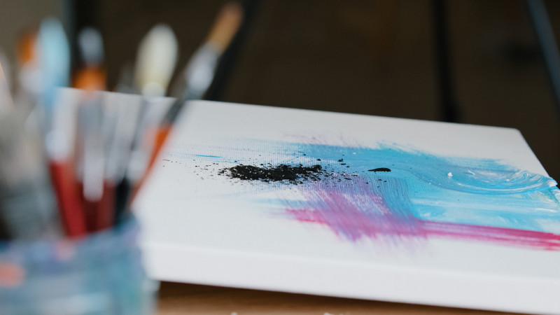 vecteezy-close-up-black-dark-paint-splatters-on-canvas-with-pink-and-54213838-scaled-16721256